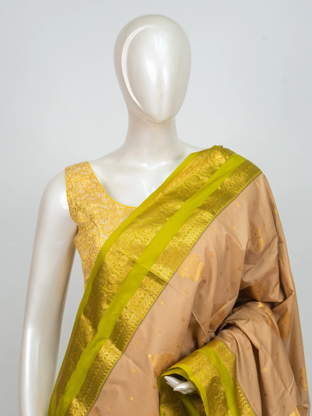 Beige semi silk saree with lime green gold zari contrast border and zari pallu