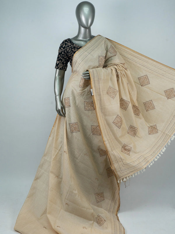 Cream linen cotton saree with gold zari border and embroidered diamond motifs