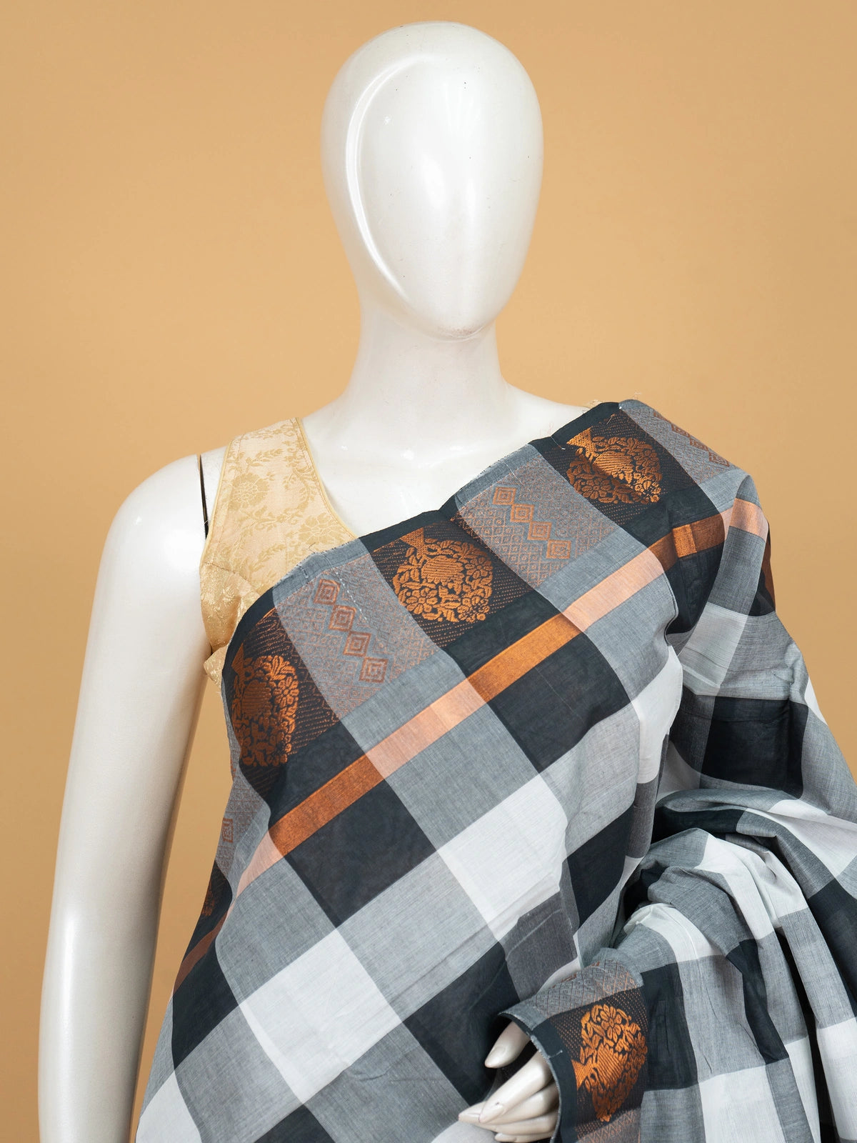 Grey and black checked Chettinad cotton saree with copper zari floral border