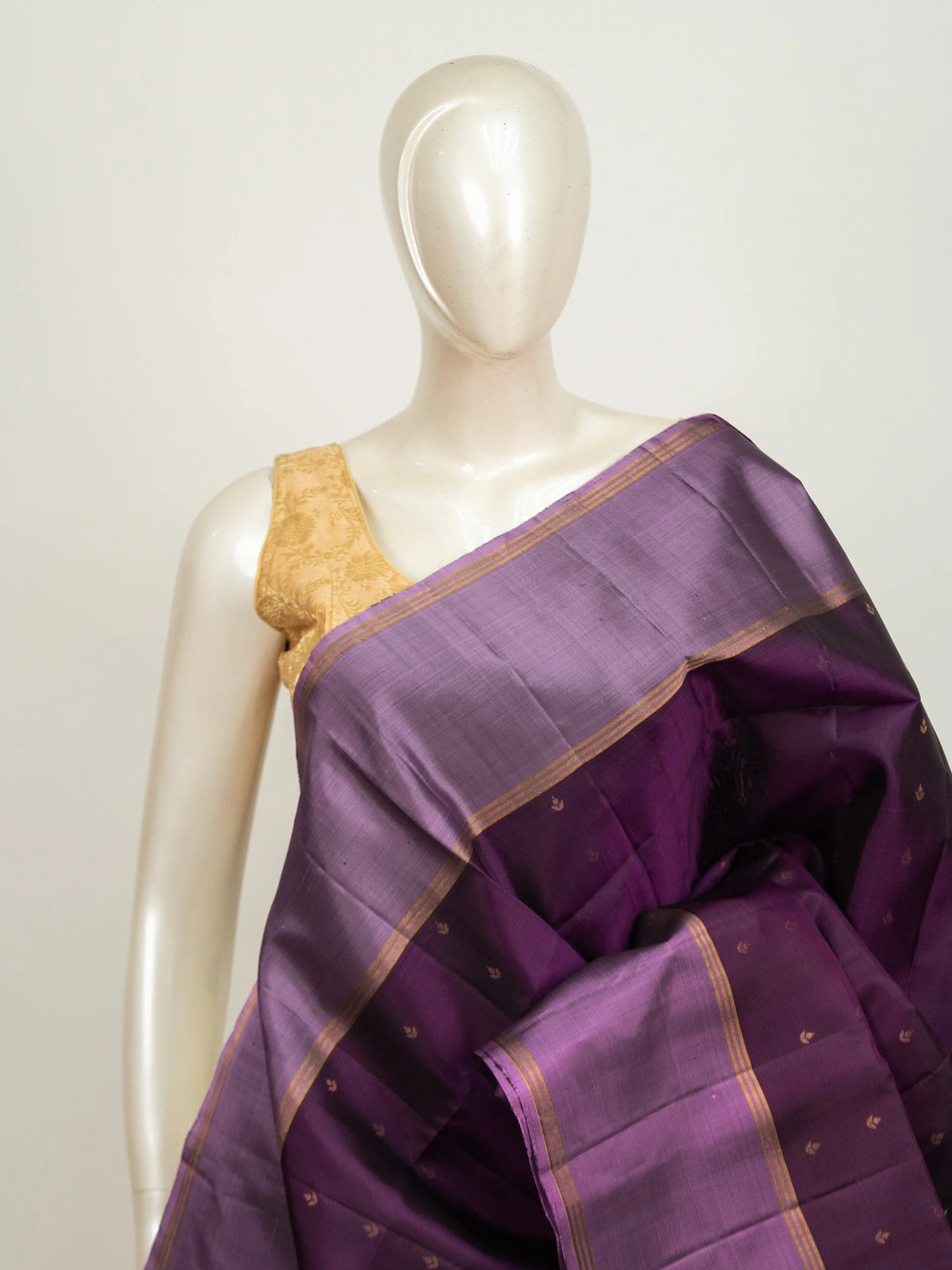 Purple pure soft silk saree with lavender contrast border, gold zari buttis and floral zari pallu