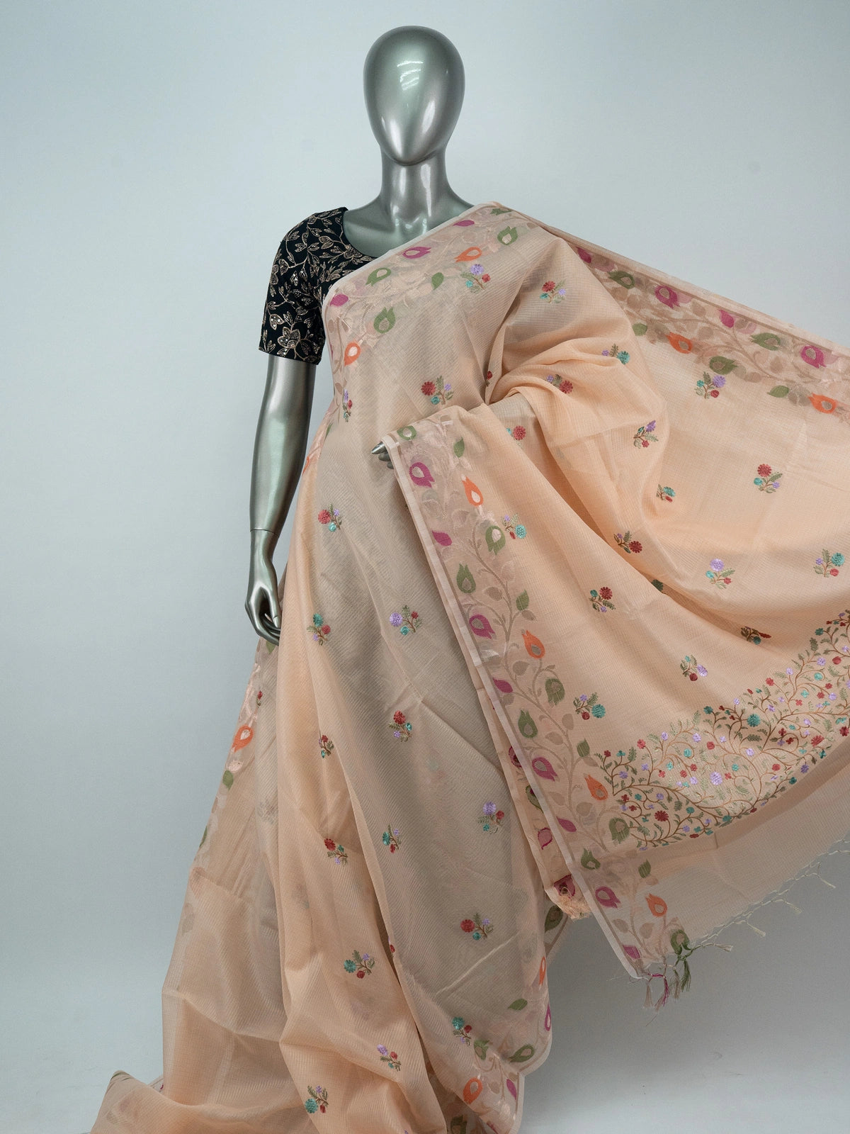 Peach linen cotton saree with multicolour floral embroidery, kota-check texture and paisley border with black embroidered blouse
