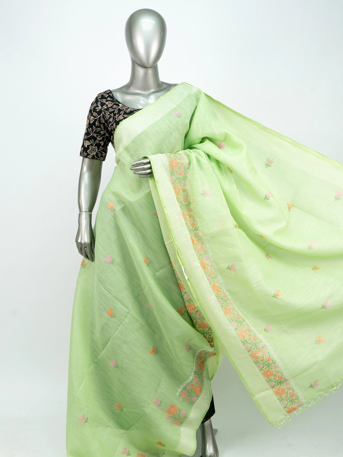 Pista green linen cotton saree with pink and orange floral embroidery and silver zari border