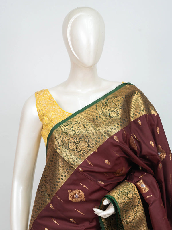 Maroon semi silk saree with gold zari buttas and a contrast teal zari border and pallu