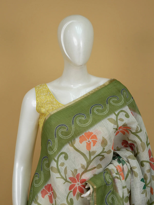 Cream linen cotton saree with floral print, green scrollwork border and paisley pallu
