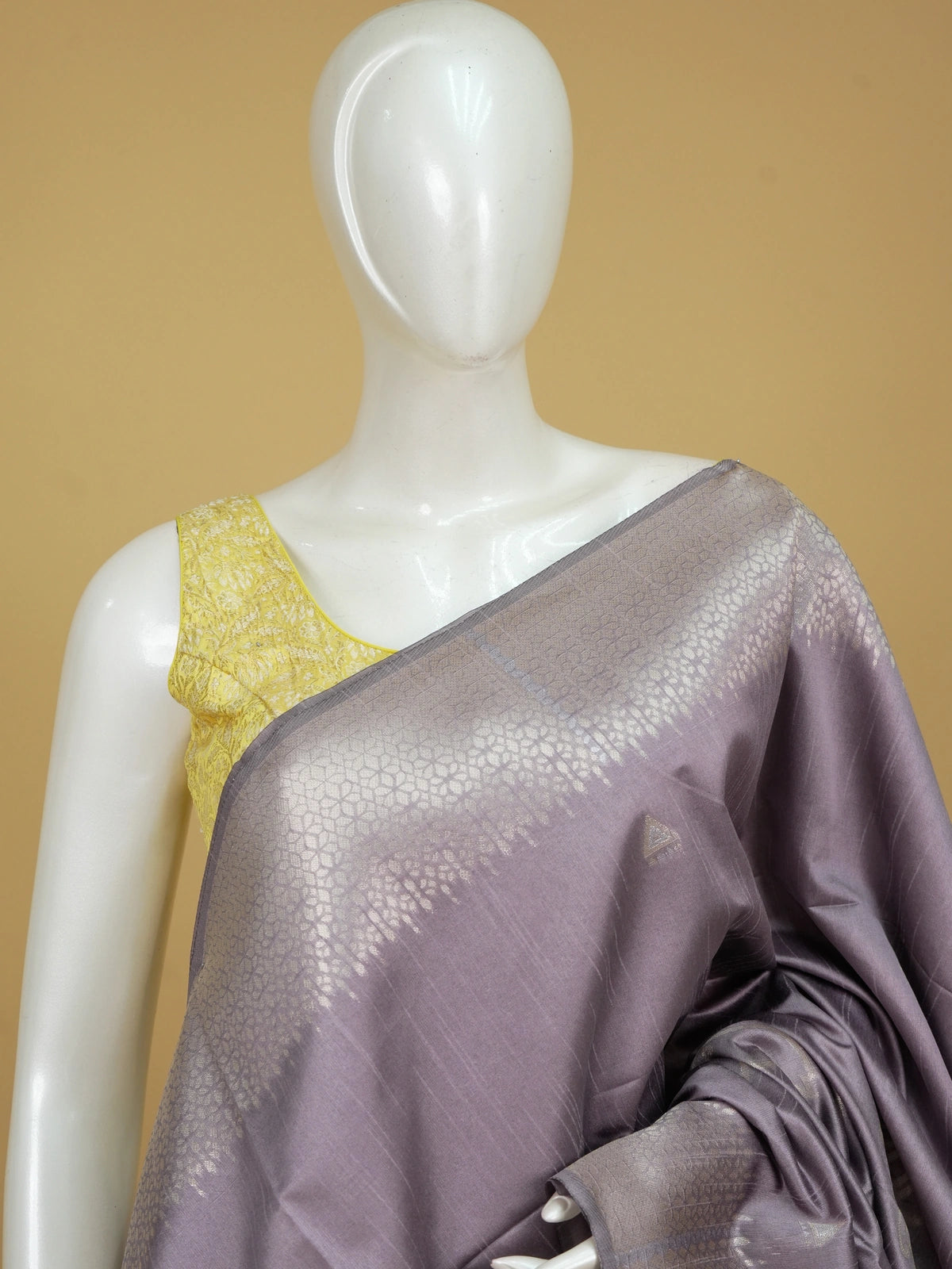 Dusty mauve semi tussar saree with silver zari floral pallu and geometric border