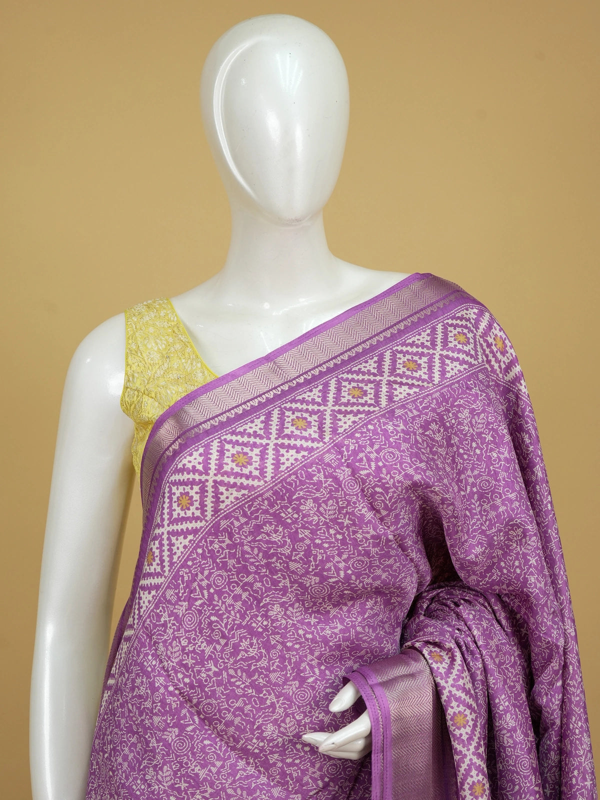 Purple Dola silk saree with white Warli-style print, patola pallu and silver zari border
