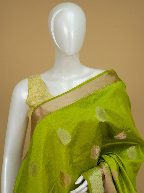 Lime green semi tussar saree with gold and silver floral buttas and contrast beige-gold zari border