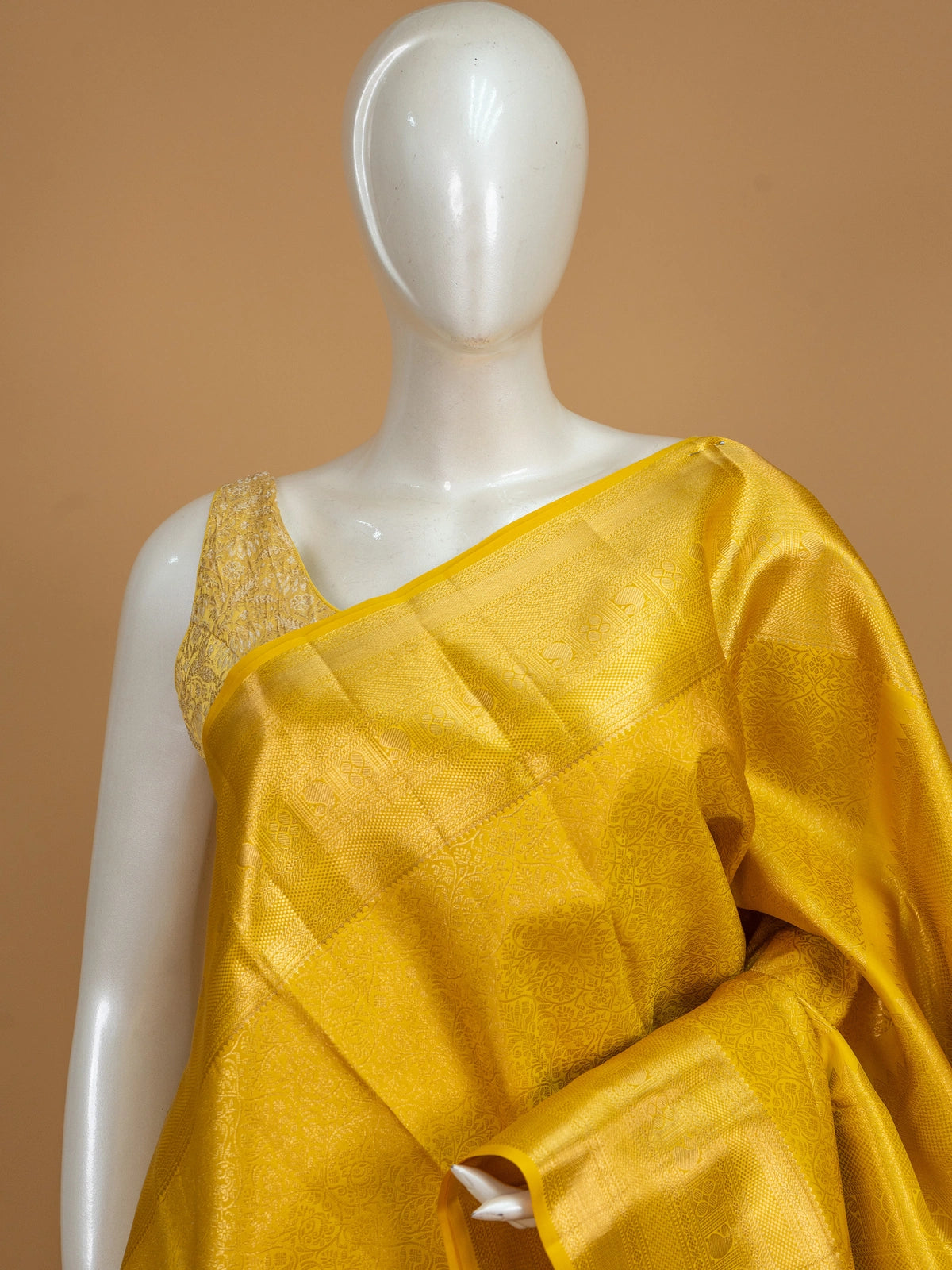 Yellow and gold pure Kanchipuram silk saree with all-over zari jaal and motif pallu
