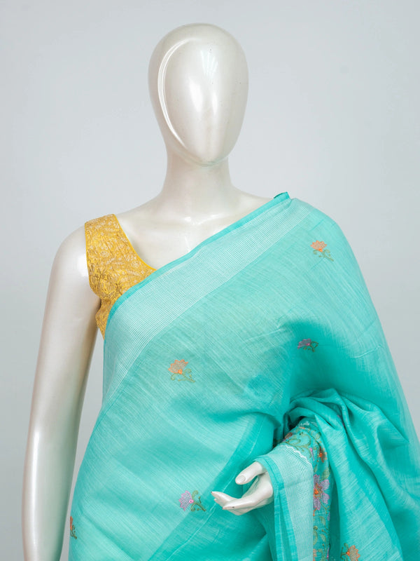 Aqua turquoise linen cotton saree with floral embroidery buttis, silver zari border and embroidered floral pallu