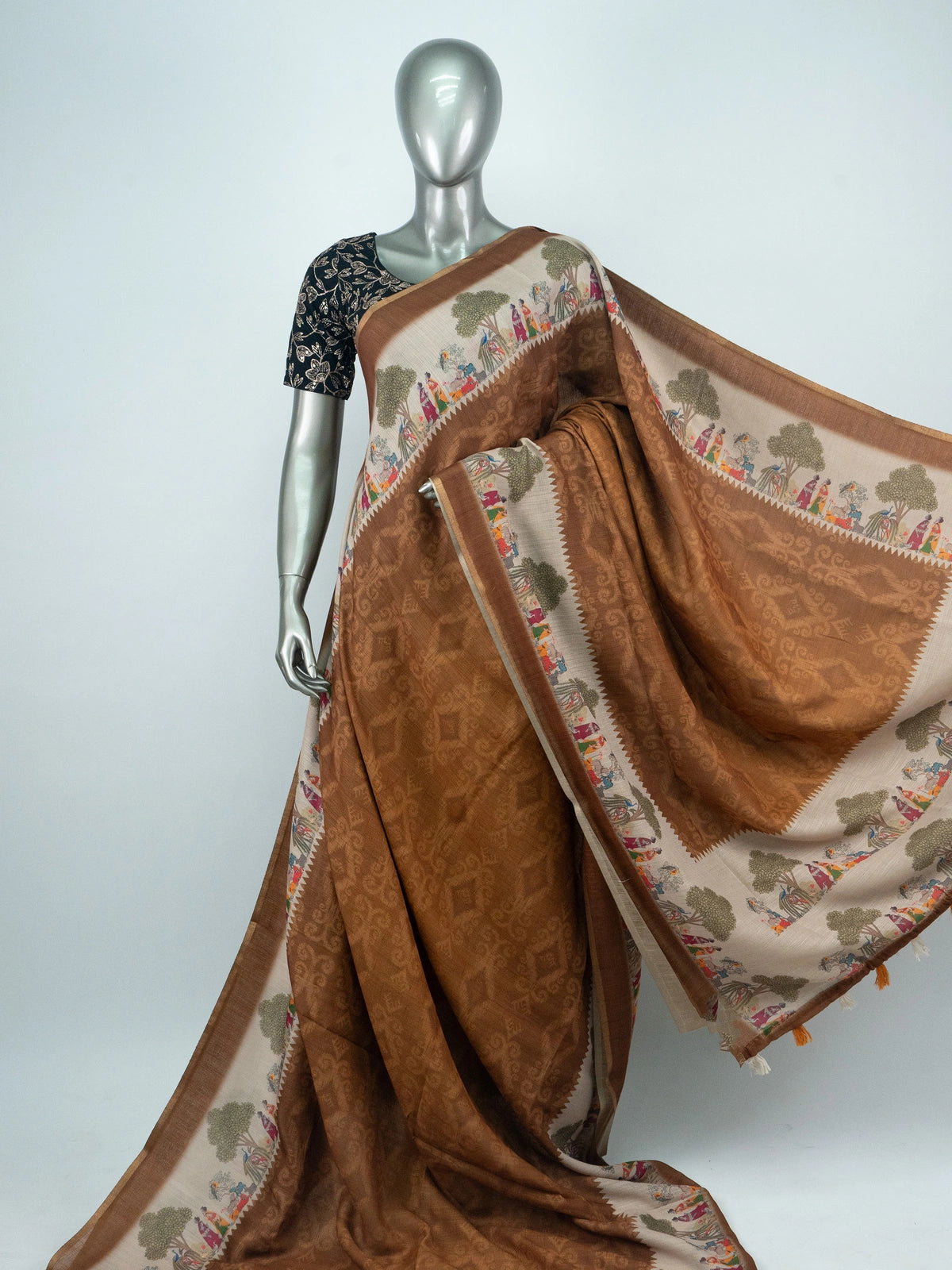 Brown and cream linen cotton saree with pichwai-style printed border, ikat body and contrast black blouse