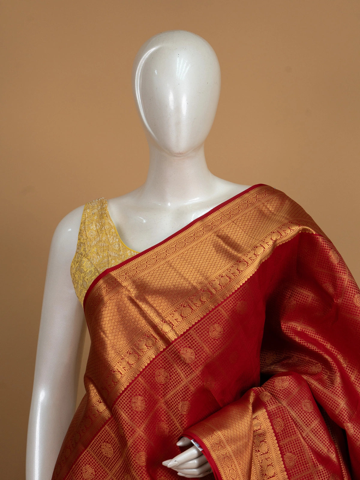 Red pure Kanchipuram silk saree with checked body, gold zari border and ornate zari pallu