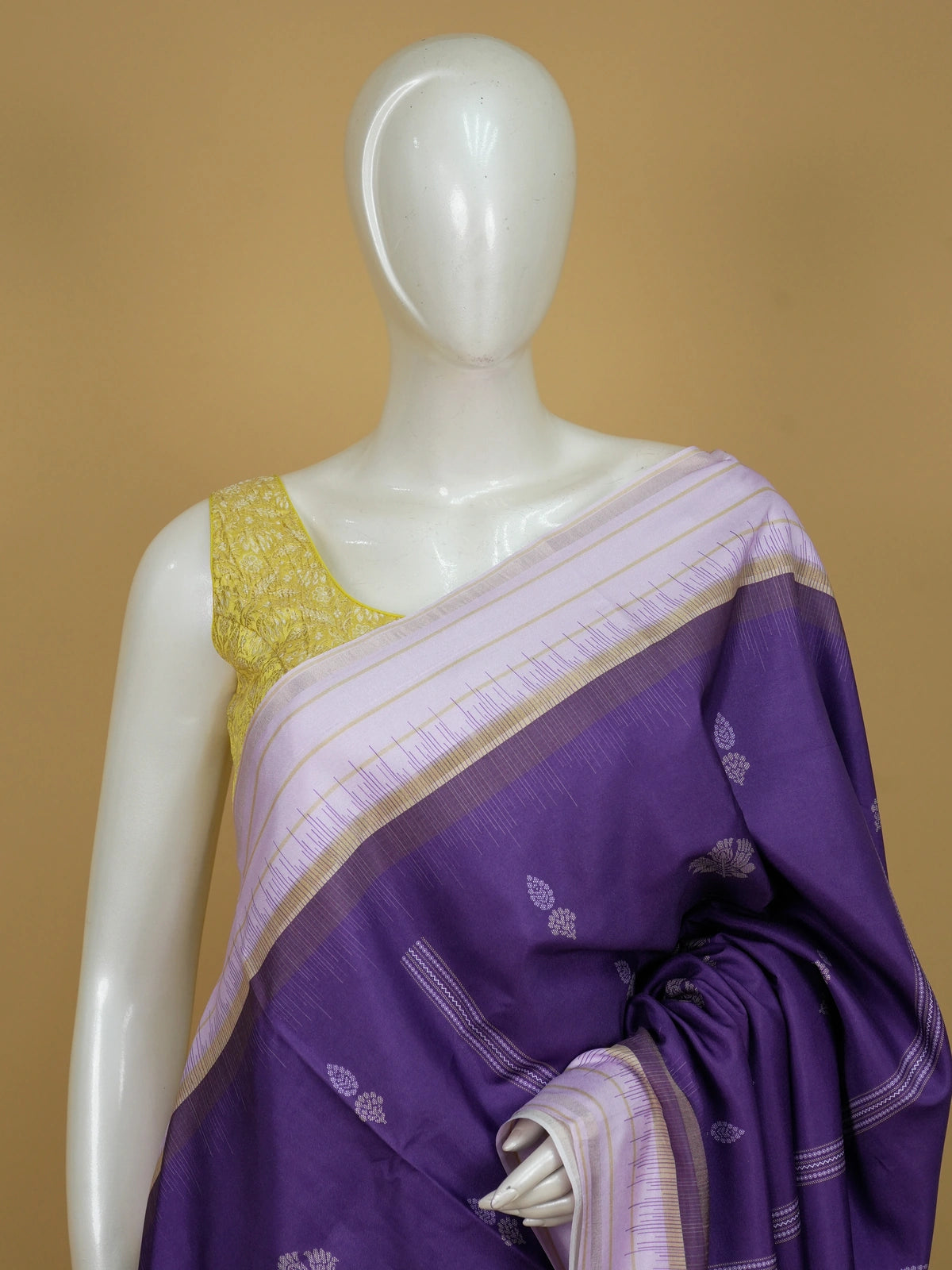 Purple Dola silk saree with lavender contrast border, floral buttas, and patterned pallu