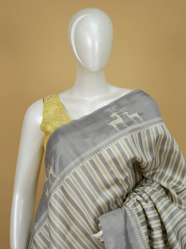 Grey and cream designer saree with embroidered deer motifs and floral pallu
