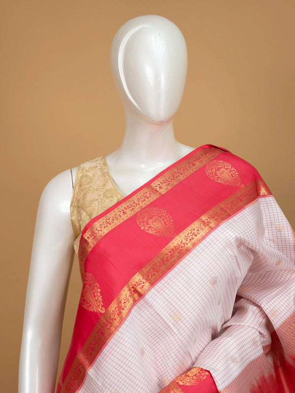White and rani pink pure Kanchipuram silk saree with checked body, gold zari buttis and contrast zari border