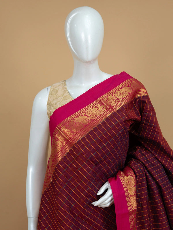 Maroon Chettinad cotton saree with checked body, contrast pink zari border and gold peacock motif pallu