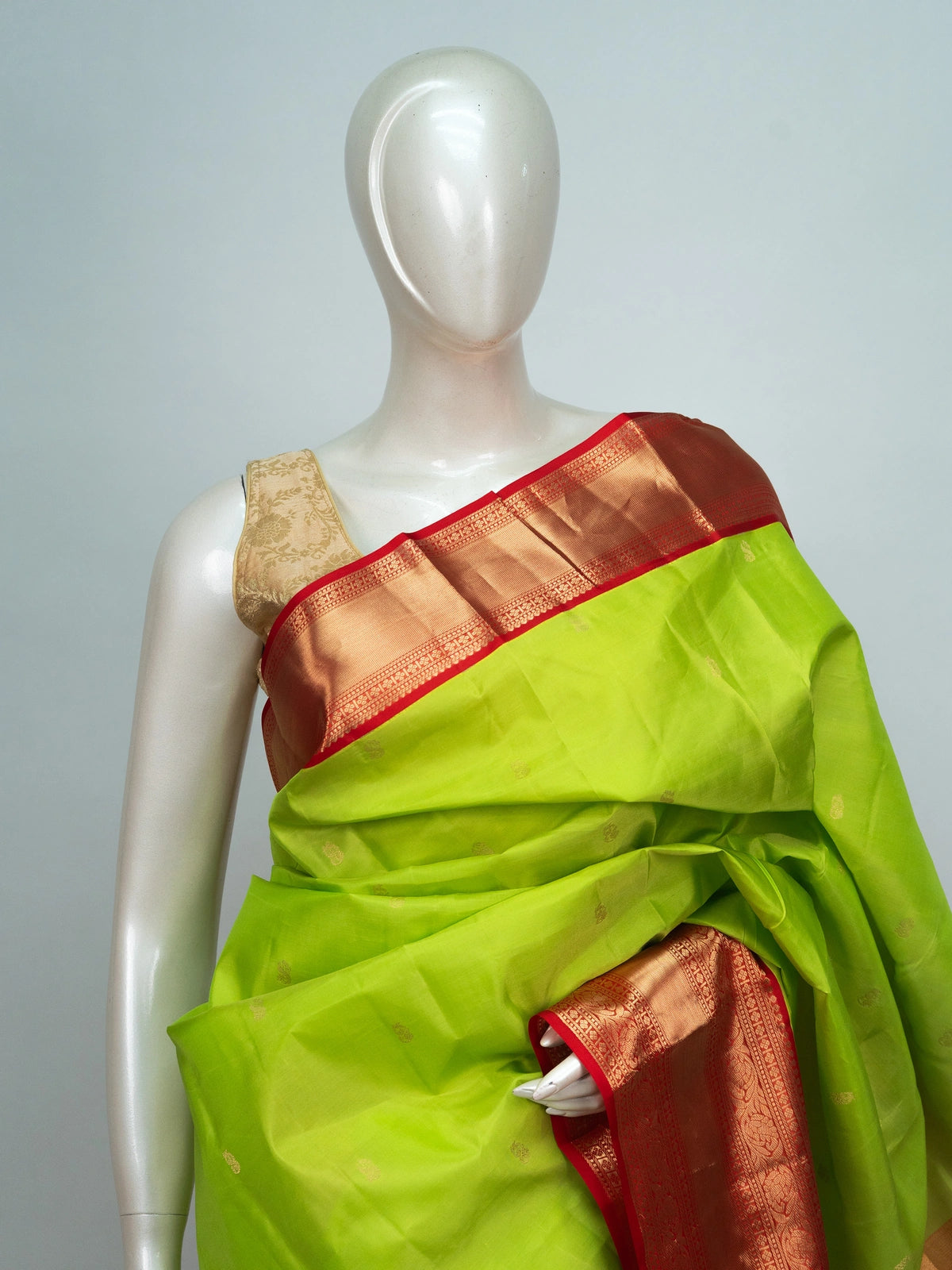 Parrot green pure Kanchipuram silk saree with contrast red gold zari border and pallu