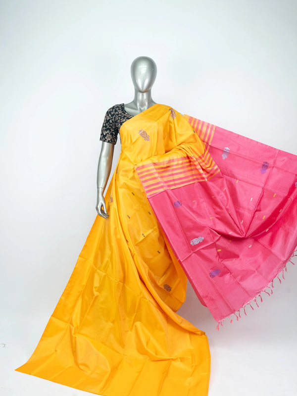 Mustard yellow banana silk saree with contrast pink striped pallu and woven buttas
