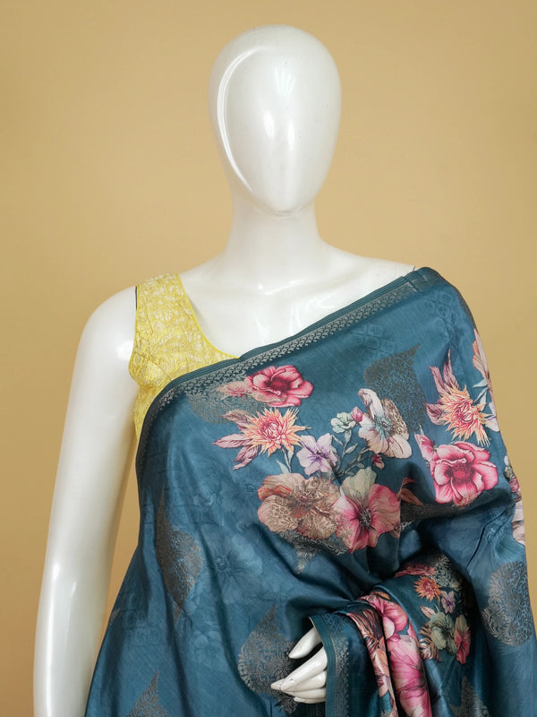 Teal blue semi tussar saree with multicolour floral print and silver zari border