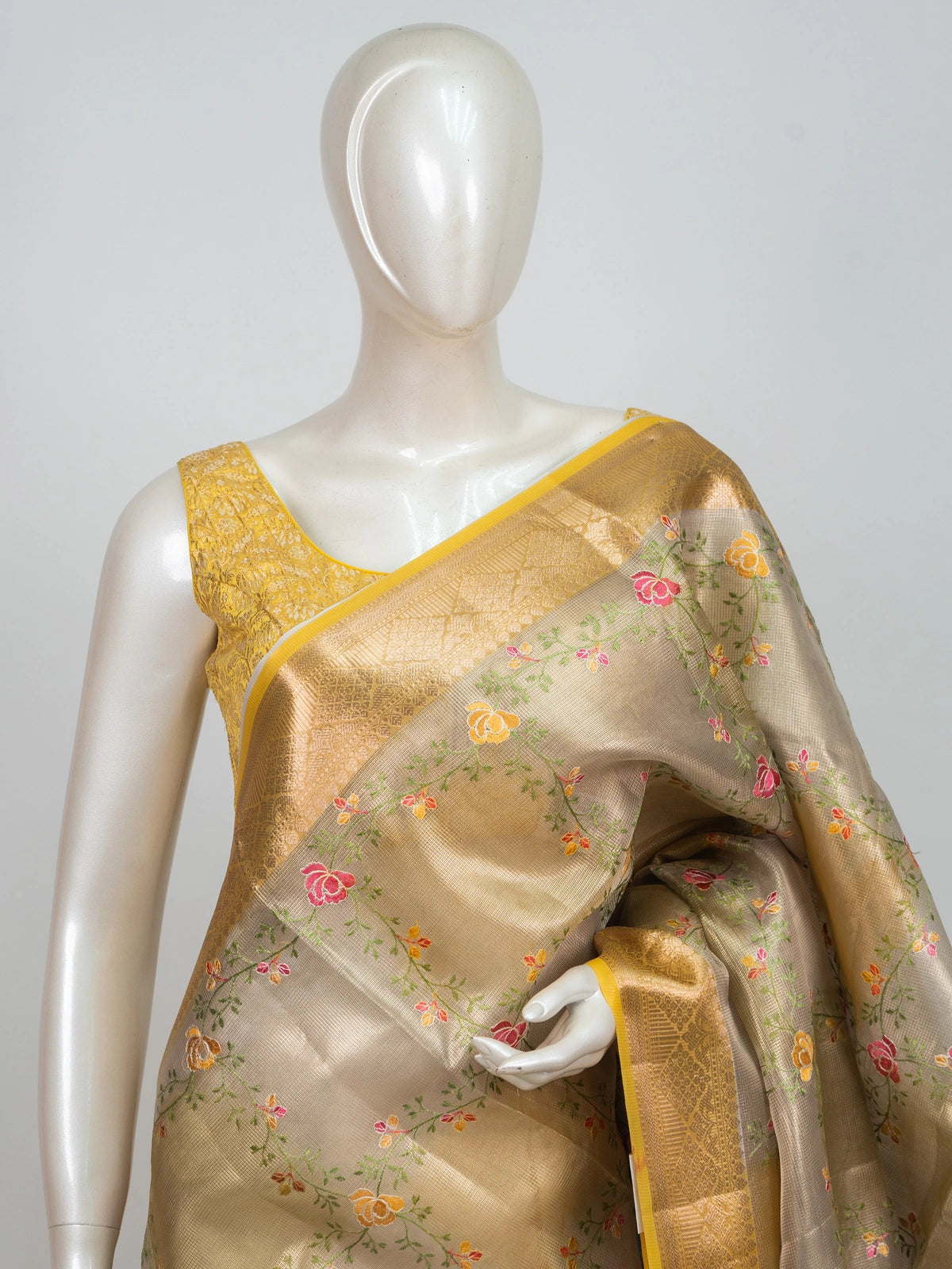Golden beige semi raw silk saree with multicolour floral embroidery and gold zari border