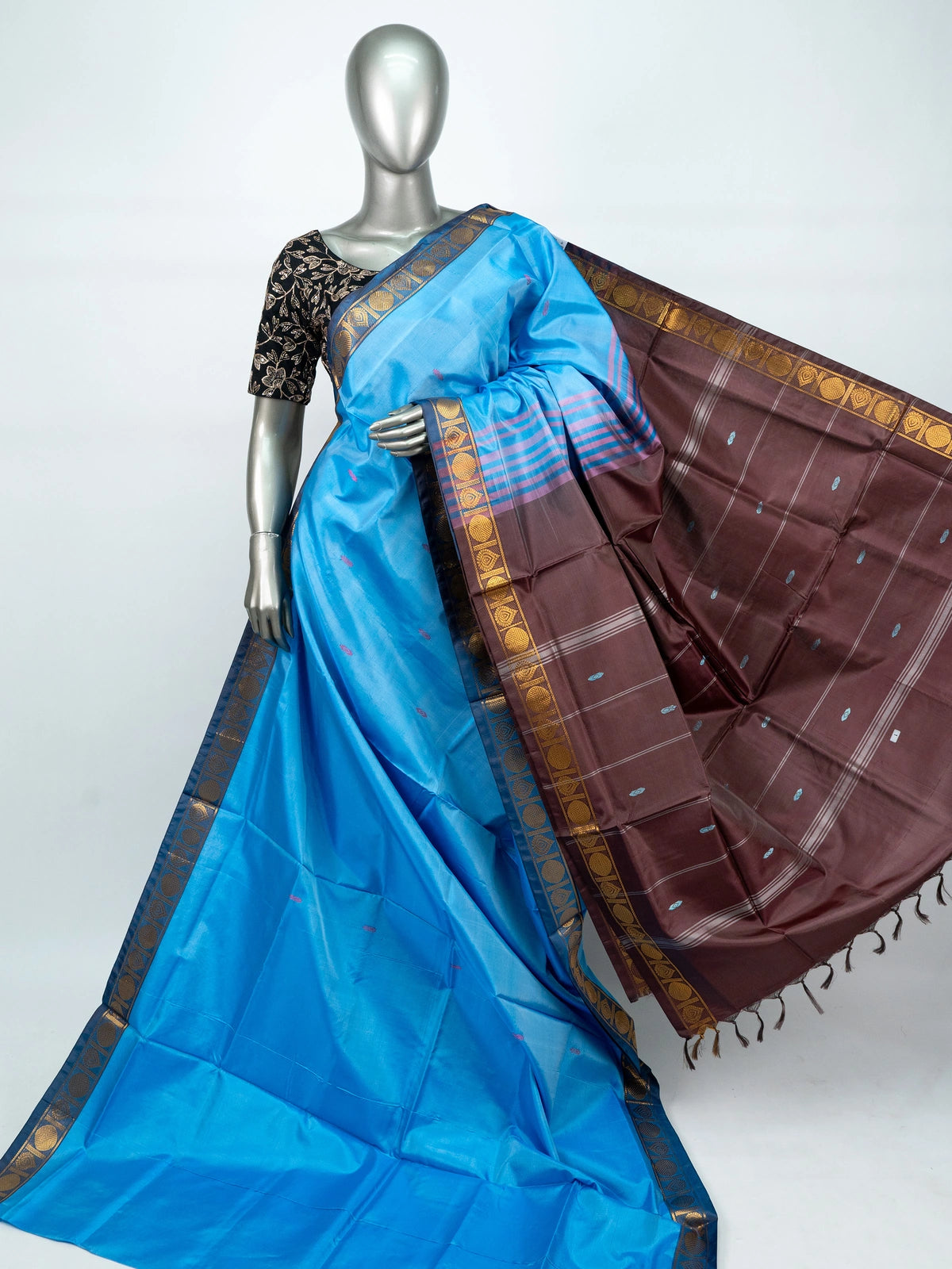 Sky blue banana silk saree with contrast brown pallu and gold zari border