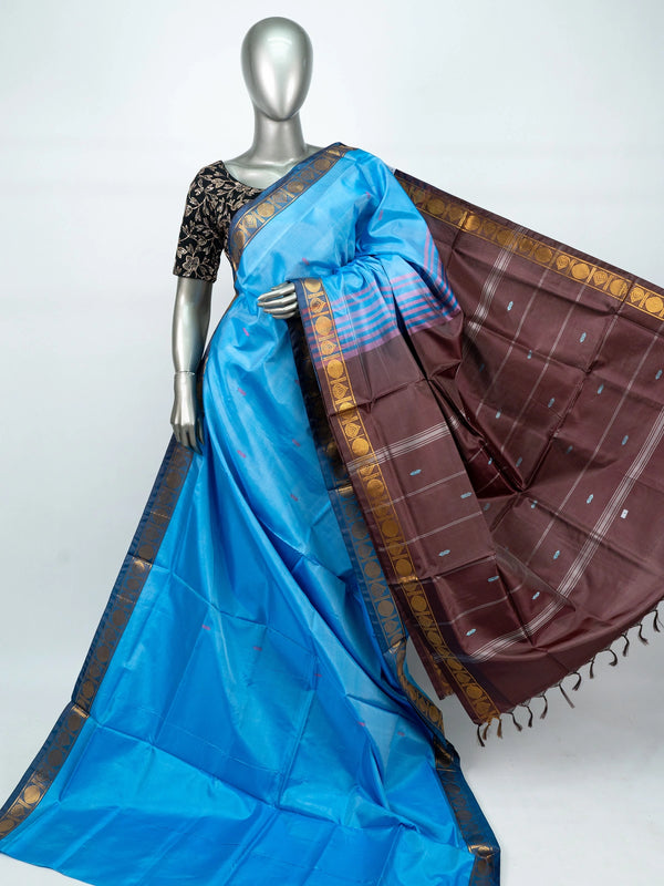 Sky blue banana silk saree with contrast brown pallu and gold zari border