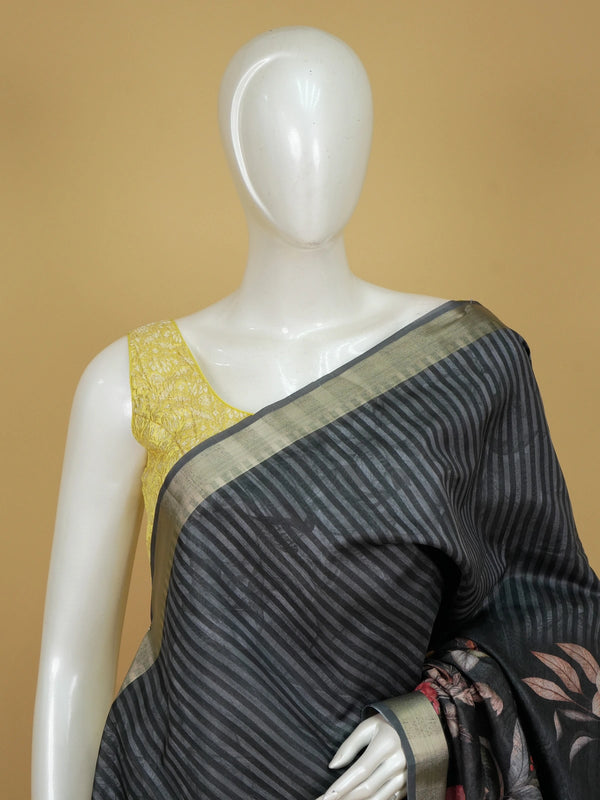 Black semi tussar saree with diagonal stripes, gold zari border and tropical floral hummingbird print pallu