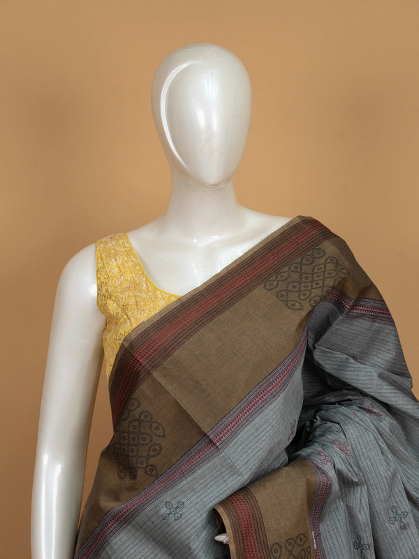 Grey and brown semi raw silk saree with contrast thread border and woven kolam motifs