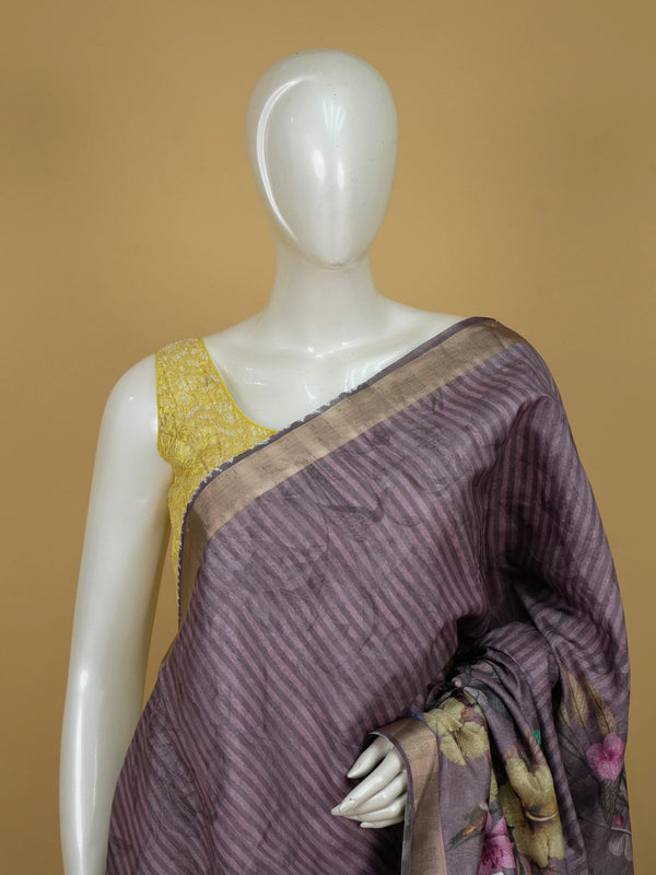 Mauve semi tussar saree with tropical floral printed pallu, gold zari border and contrast yellow blouse