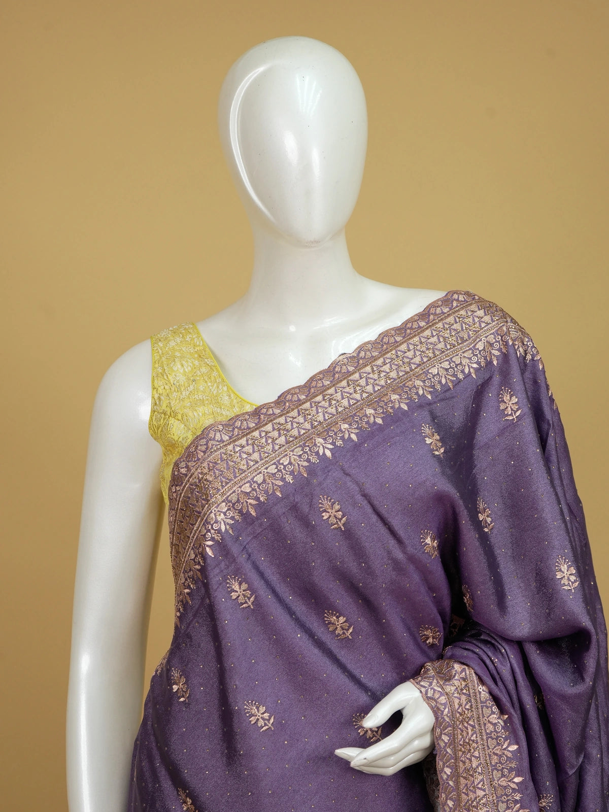 Mauve purple designer saree with gold embroidered floral butis and ornate zari border