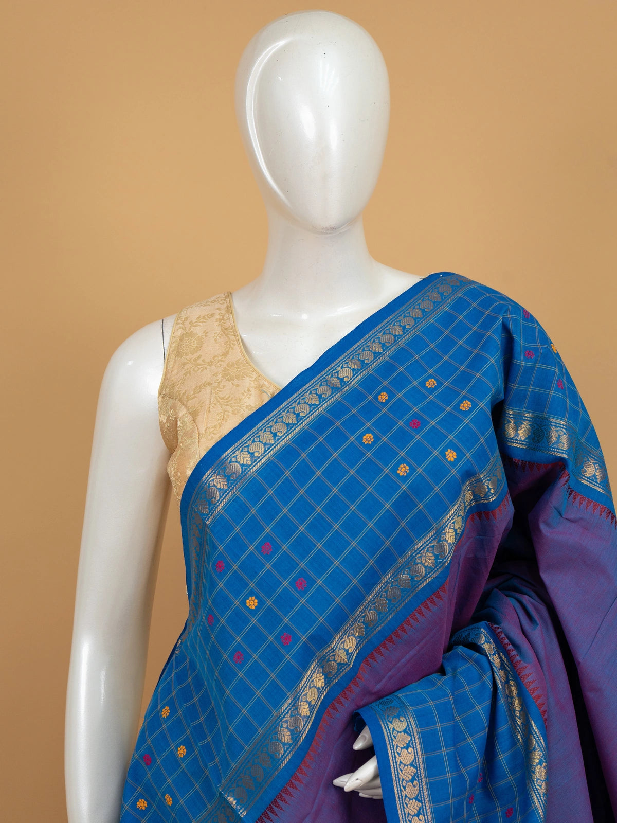 Royal blue Chettinad cotton saree with checked body, floral buttas and contrast purple striped pallu