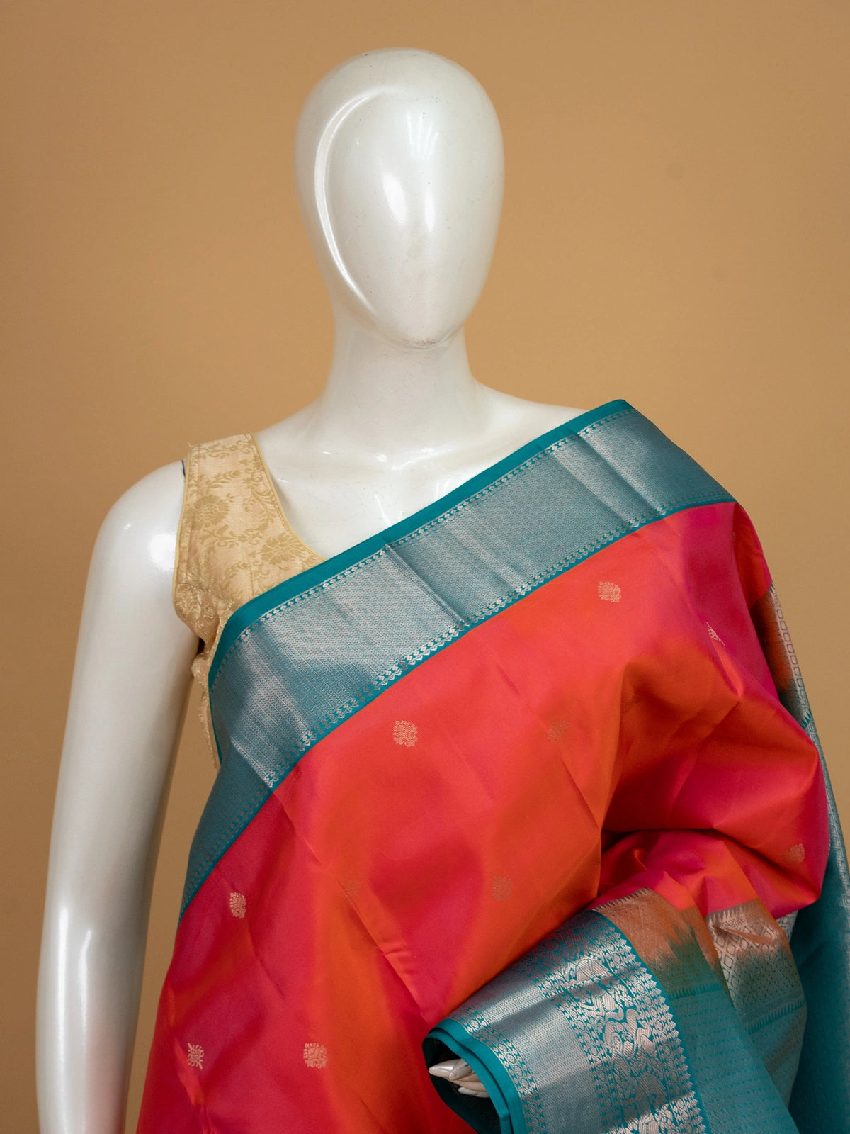 Pink and teal pure Kanchipuram silk saree with silver zari peacock border and gold buttas