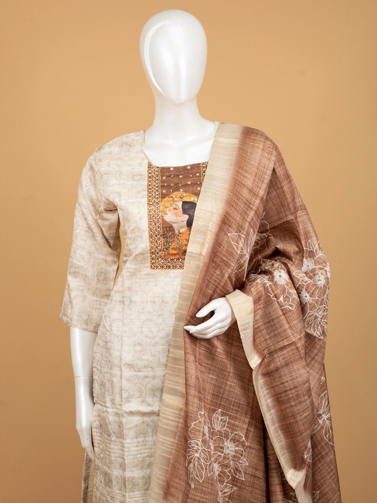 Beige tussar silk straight cut kurti set with artistic printed yoke and contrasting brown embroidered dupatta