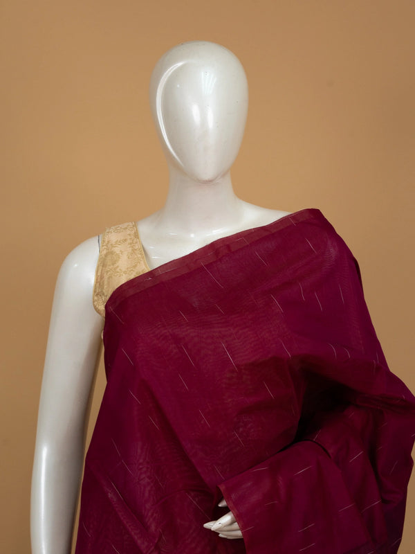 Deep magenta silk cotton saree with fine zari stripes and a dark contrast striped pallu