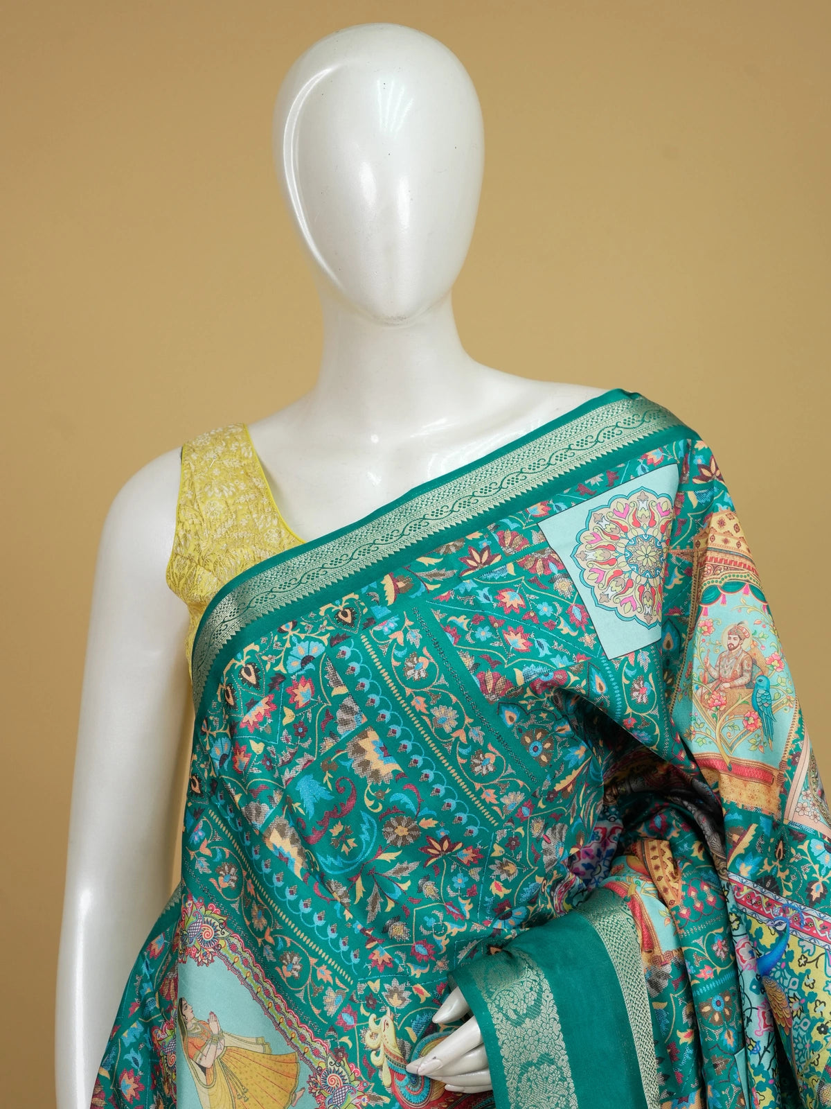Teal green Dola silk saree with peacock and elephant patchwork print and gold zari border