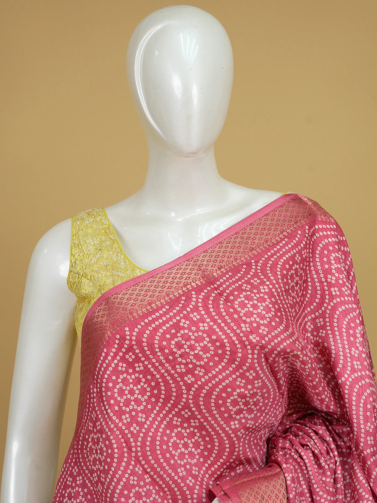 Pink bandhani-print Dola silk saree with gold zari border and floral paisley pallu