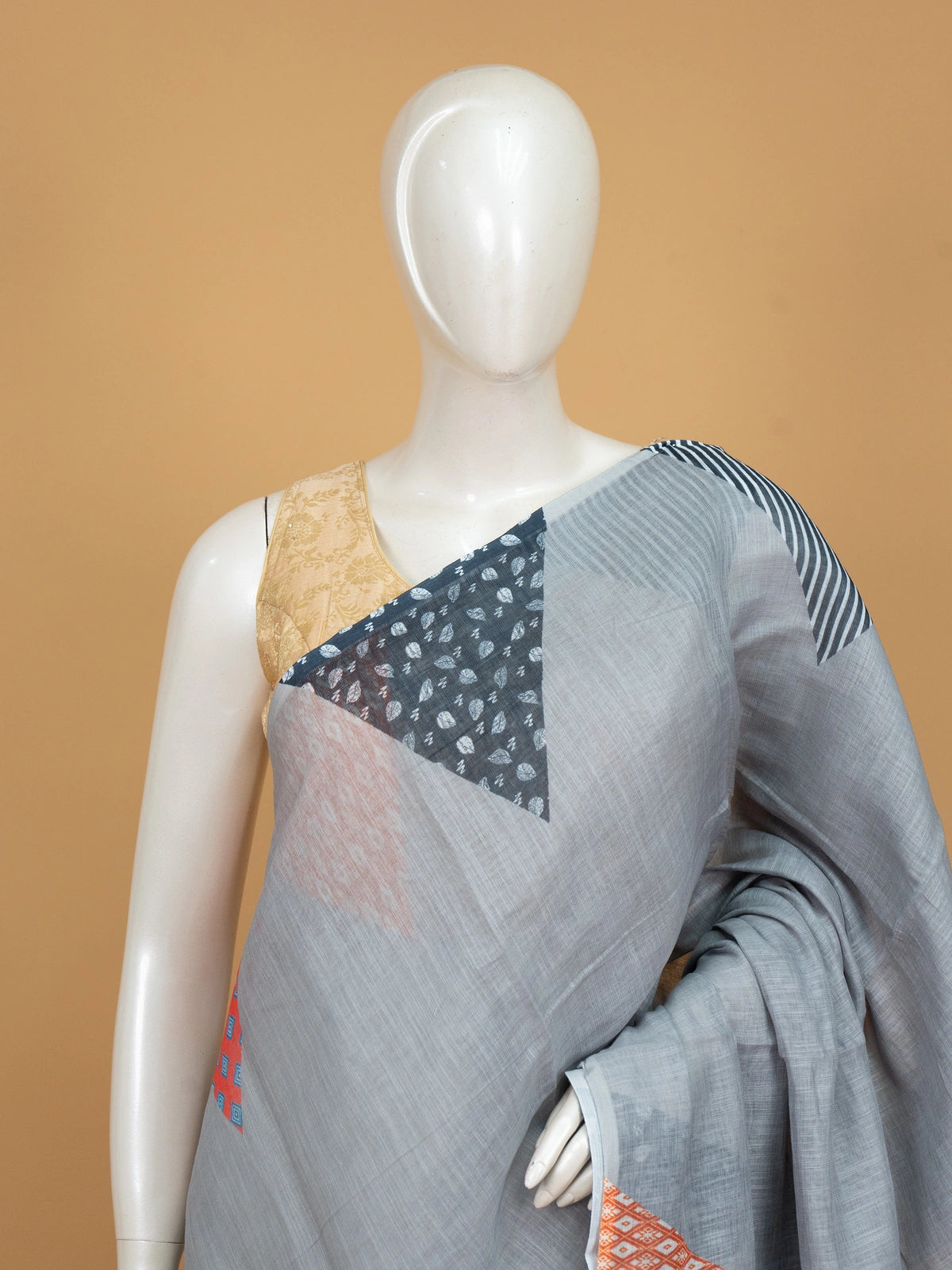 Grey linen cotton saree with multicolour patchwork print pallu and border