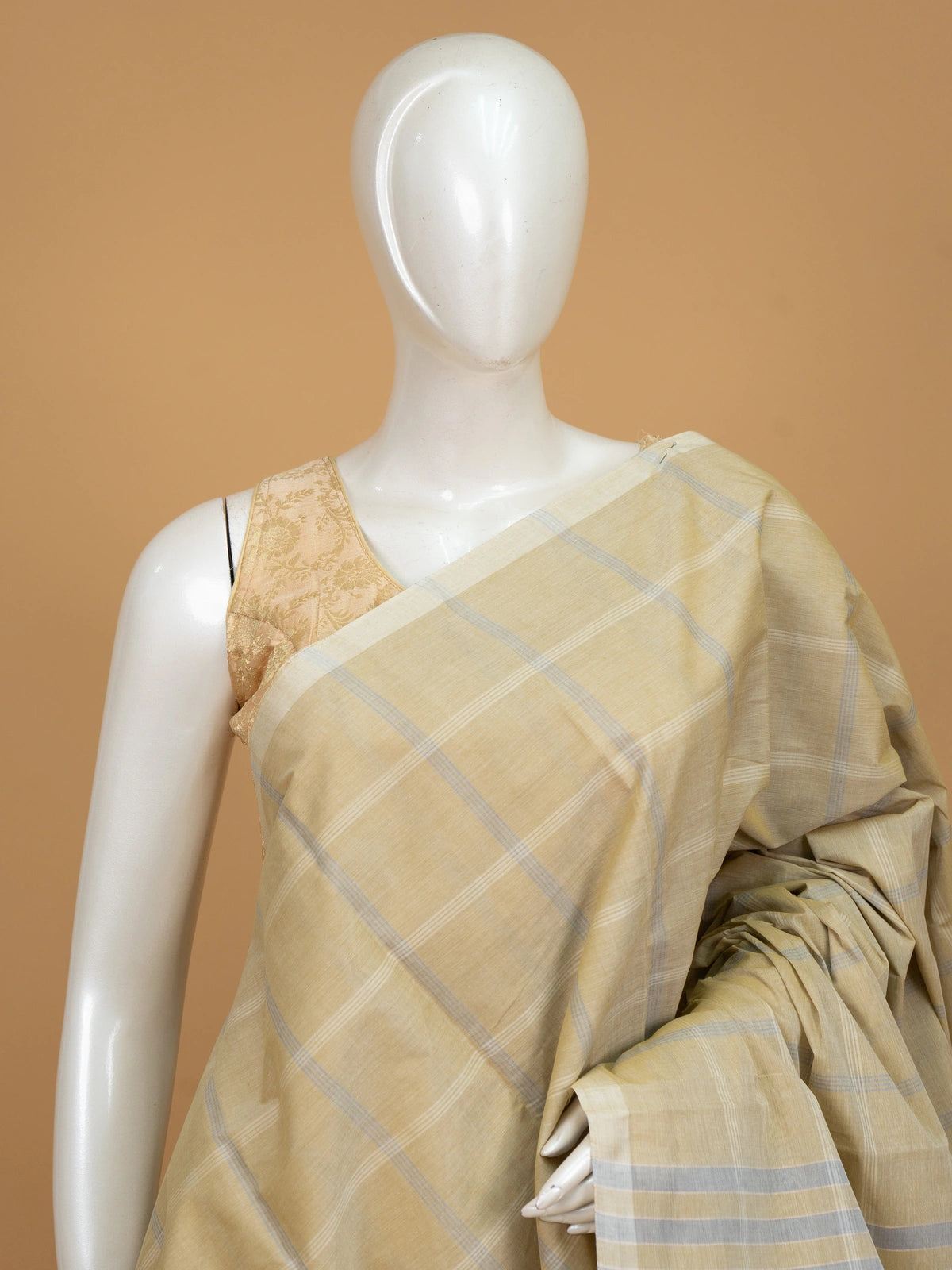 Beige and grey checked silk cotton saree with striped pallu and matching blouse