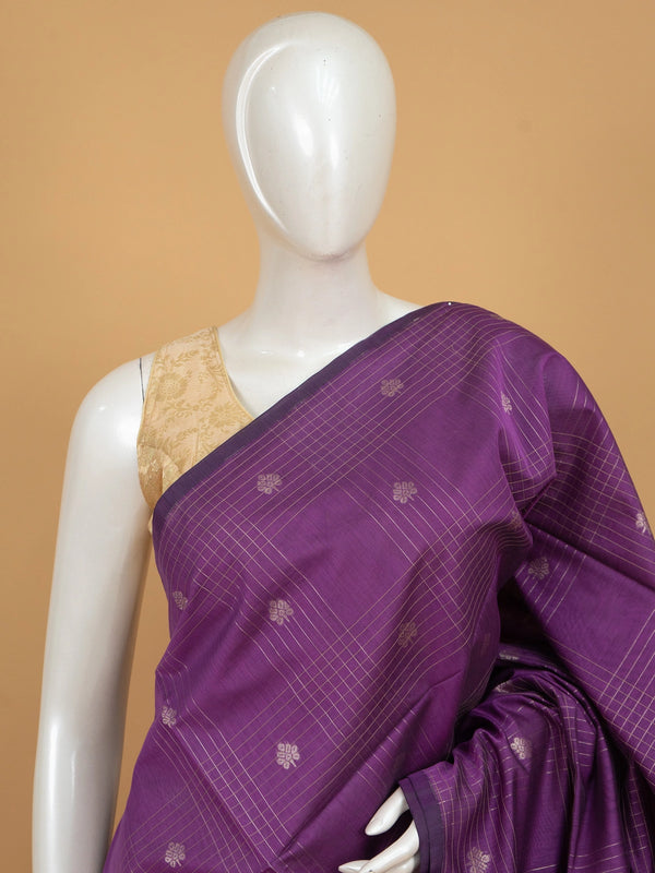 Purple silk cotton saree with silver zari checks, floral buttas and ornate woven border