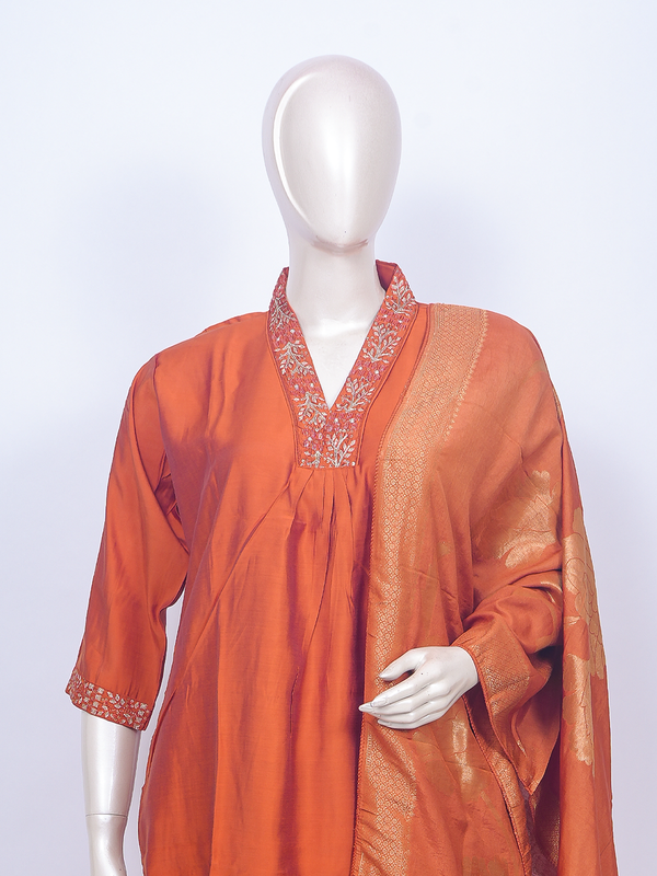 Orange art silk kurti set with embroidered V-neck and gold zari woven dupatta