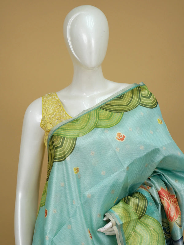 Turquoise semi tussar saree with green scalloped border and Kalamkari-style lotus and crane printed pallu