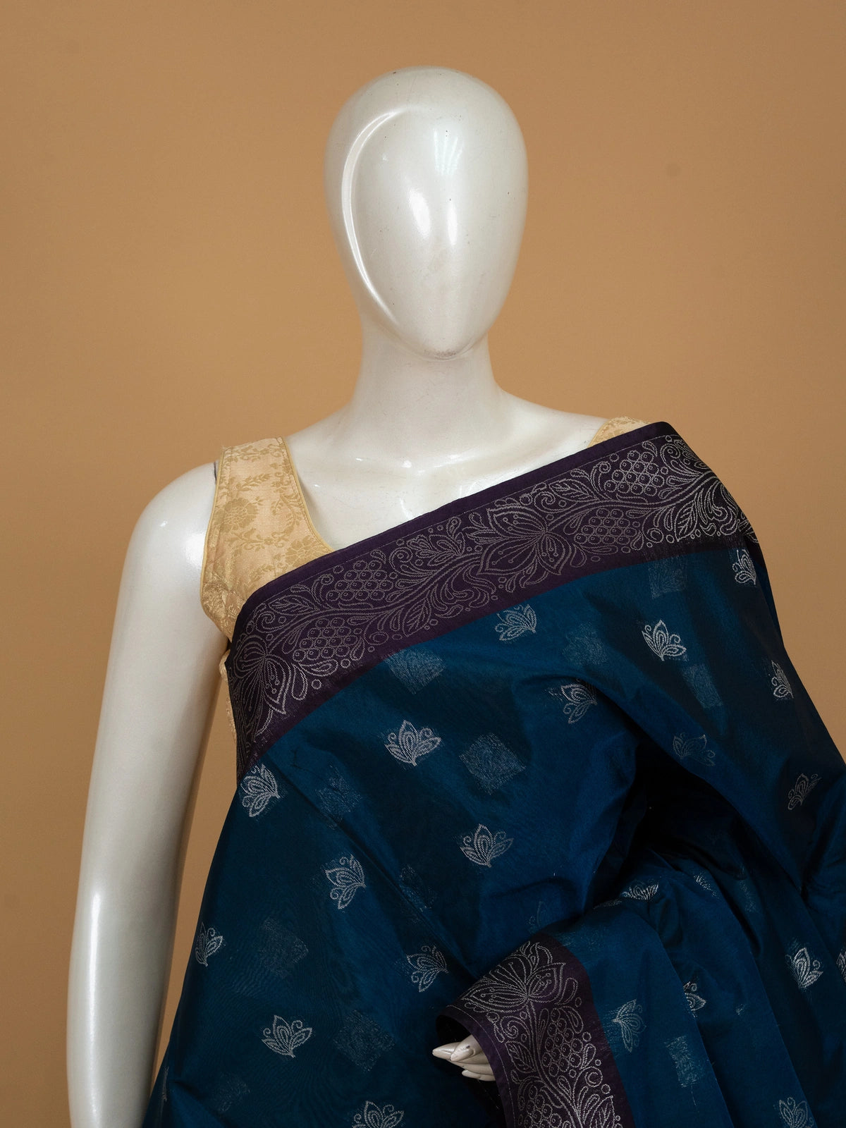 Peacock blue silk cotton saree with silver lotus buttas and contrast purple silver-woven border