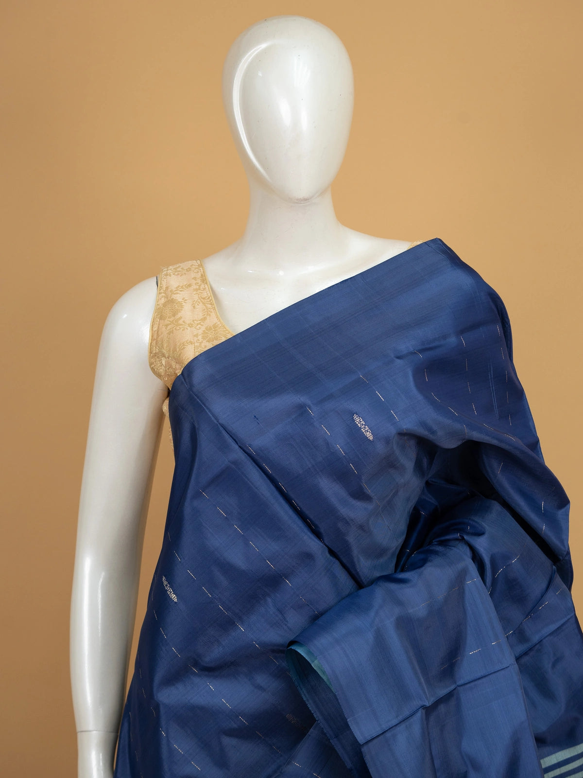 Navy blue banana silk saree with sky-blue contrast pallu, zari stripes and striped border