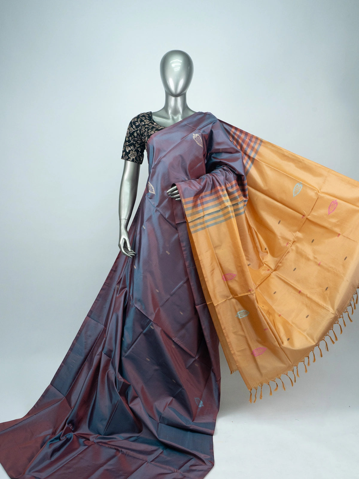Mauve-grey dual-tone Banana Silk saree with gold zari butis and a contrast mustard pallu