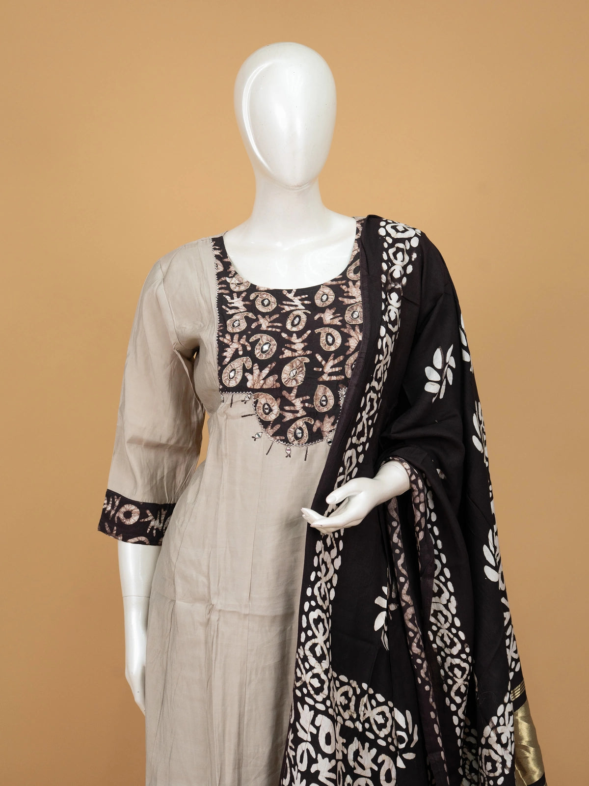 Grey batik cotton A-line kurti set with mirror work yoke and black batik dupatta with gold zari border