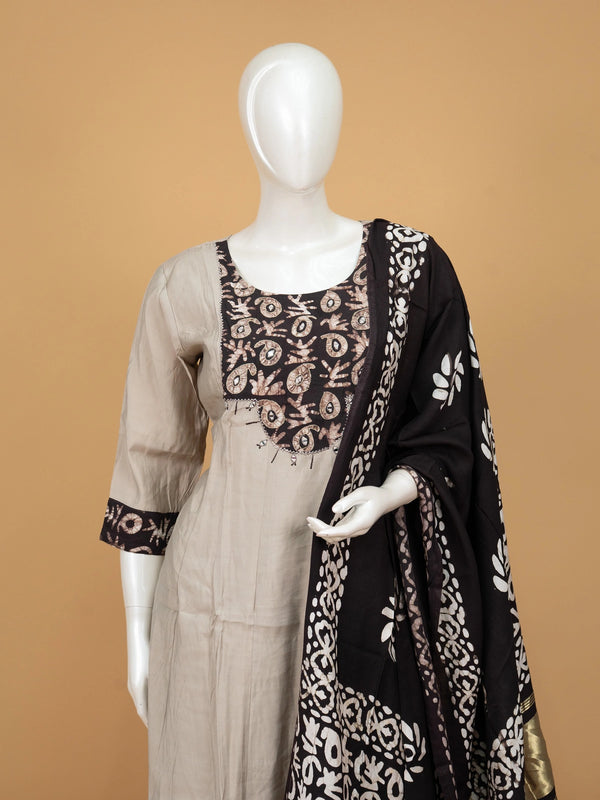 Grey batik cotton A-line kurti set with mirror work yoke and black batik dupatta with gold zari border