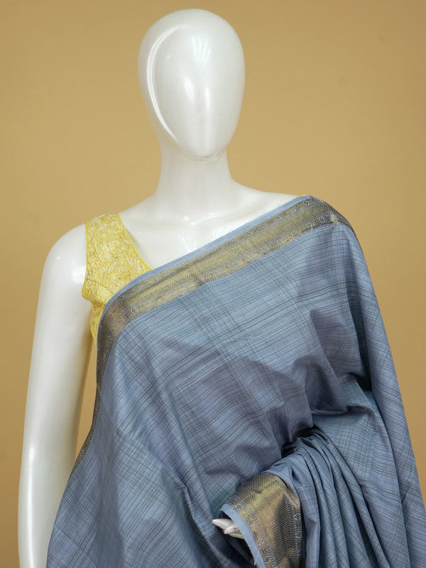 Grey semi tussar saree with crosshatch weave and gold zari border