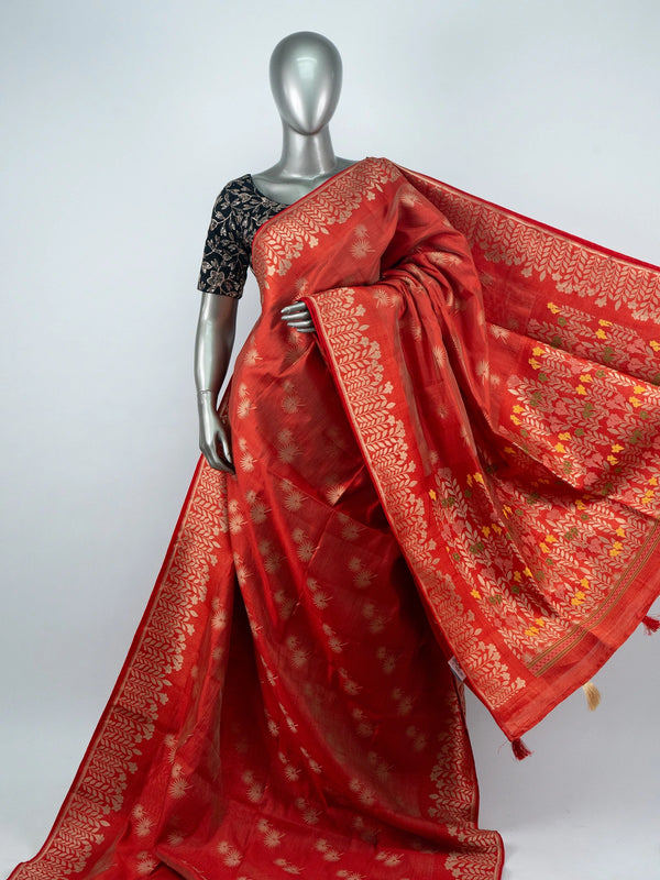 Red semi raw silk saree with gold zari butas, leaf-vine border and multicoloured floral pallu