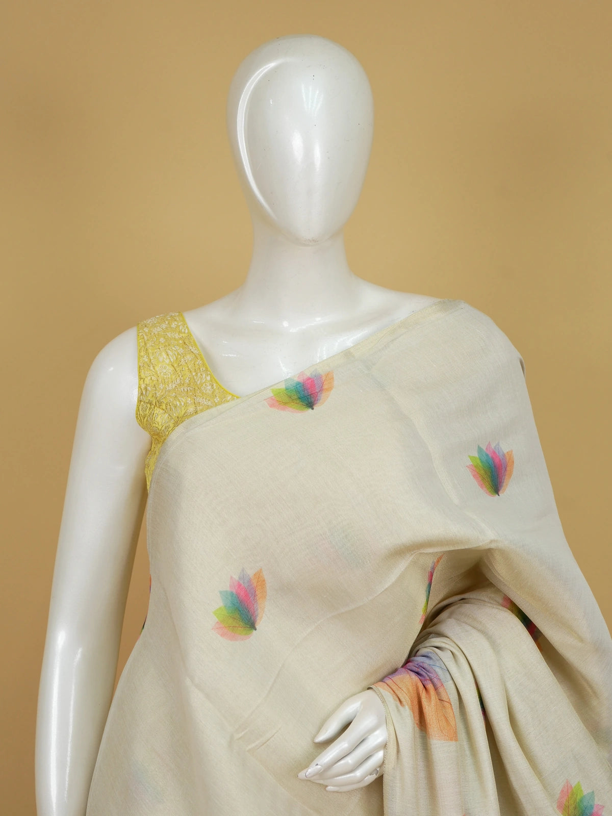 Cream linen cotton saree with multicoloured leaf and lotus-petal prints