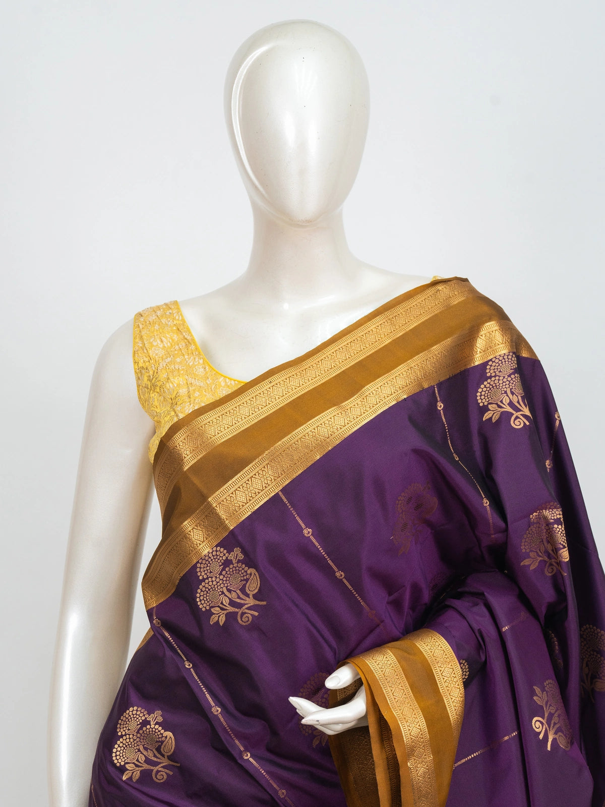 Purple Kanchipuram fancy silk saree with mustard-gold zari border, floral buttas and paisley pallu