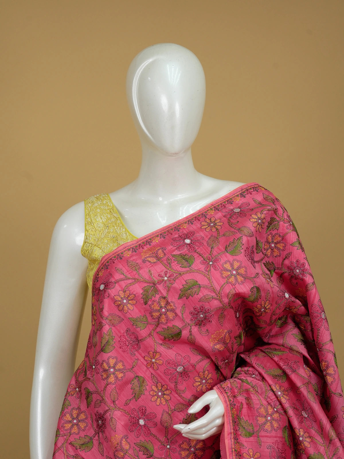Pink semi tussar saree with multicoloured floral embroidery and contrast yellow blouse